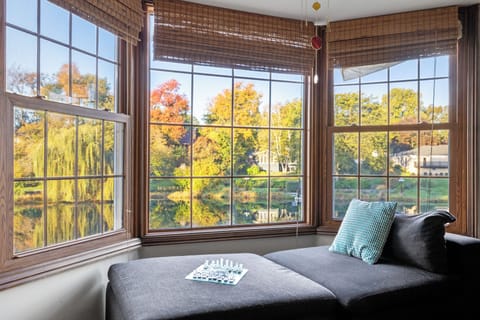 Relax and enjoy a game of chess or a good book from this cozy nook overlooking the water.