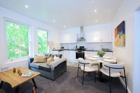 Relax in a beautifully designed space where comfort meets modern luxury. This compact yet high-end lounge kitchen diner features sleek furnishings, warm lighting, and premium finishes throughout. The lounge features a plush sofa bed, a smart TV, and chic 