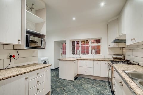 Fully equipped kitchen with access to kitchen courtyard.