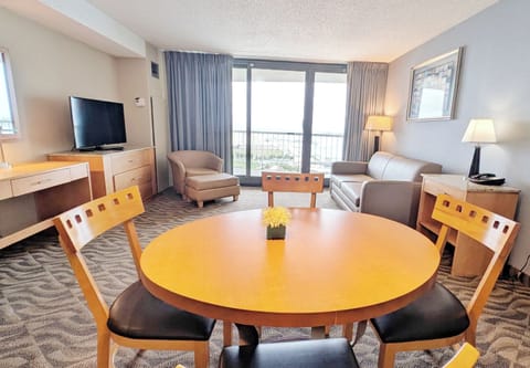 Relax in this bright, open living space with ocean-view balcony access!