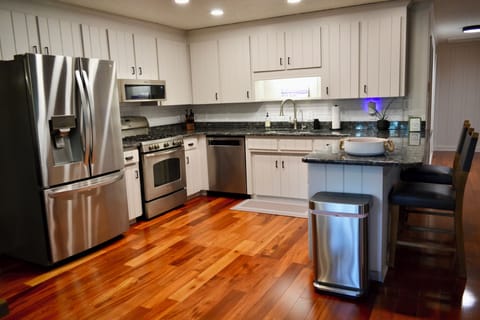 Fully stocked kitchen with gas range.