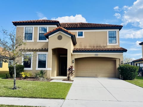 Spacious two-story home with sunny front yard and garage