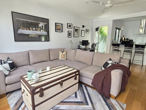 Relax in a spacious, light-filled living area designed for slow mornings and cosy nights in.