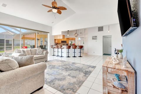 Open Concept Living | Spacious Layout with Pool Access and Breakfast Bar Seating