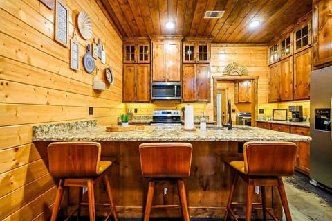 Beautiful wood cabinetry and granite island—perfect for family gatherings.
