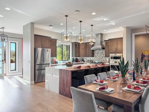 The entrance opens up to the kitchen and dining area.
