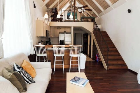 With vaulted ceilings, an open-concept kitchen, and a cozy living room, this space is perfect for families, couples, or solo travelers. Relax in a bright, airy environment with large windows that bring in natural light, and stylish decor.