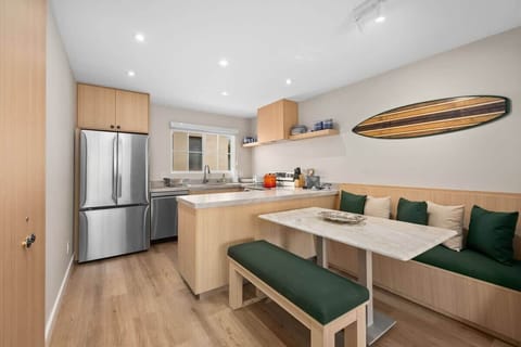 Seamless Dining-Living Flow
Open-concept layout connects the kitchen, dining, and living areas for easy vacation living.