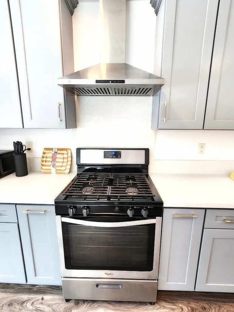 Cook your favorite meals with ease in this modern kitchen featuring stainless steel appliances and sleek cabinetry.