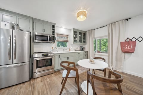 The dining area located between the kitchenette and living room fits 3-4 people.