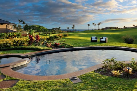 Private pool and spa overlooking the golf course with sweeping ocean and mountain views—an unforgettable Poipu backdrop from sunrise to sunset.