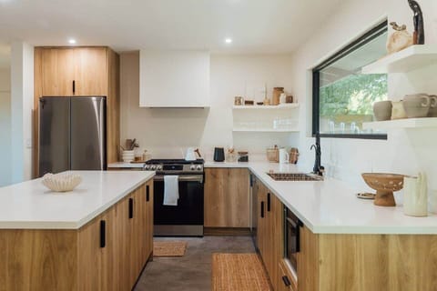 Fully-functional kitchen with all modern appliances, 'Our Place' pots and pans, plenty of plates, bowl, glassware, cutlery, triple-filtered RO water system and organic coffee and tea station.