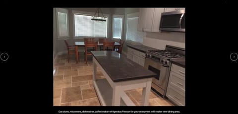 Kitchen Island and Dining Room with Water and Mountain Views!