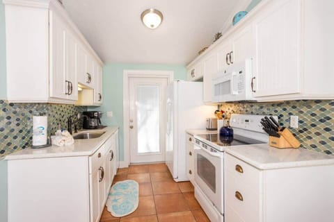 Coastal, family-friendly kitchen with modern upgrades for stress-free beach meals.