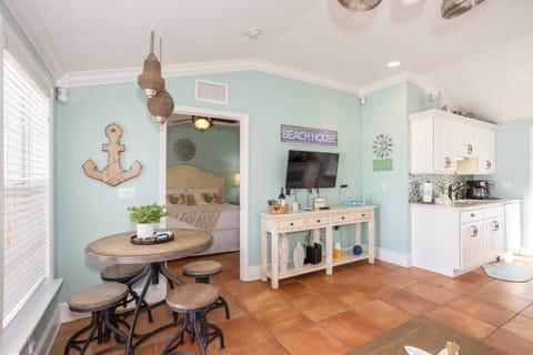 Sunny coastal lounge with Smart TV and dining for four—kick back island-style.