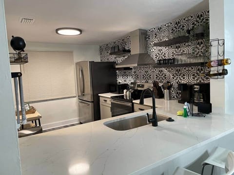 Cozy kitchen featuring a wine rack and coffee bar with wine and coffee included.