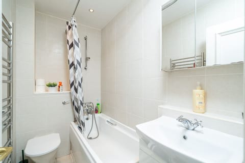Relax in the sleek, spa-inspired bathroom featuring a deep soaking tub and premium finishes.