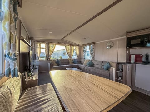 Spacious living and dining area with cozy natural light