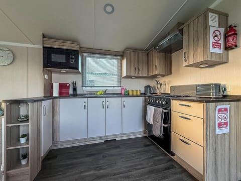 Bright, modern kitchen with ample storage and natural light