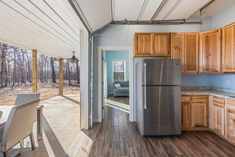 Open layout flows from kitchen to porch for easy indoor-outdoor dining.