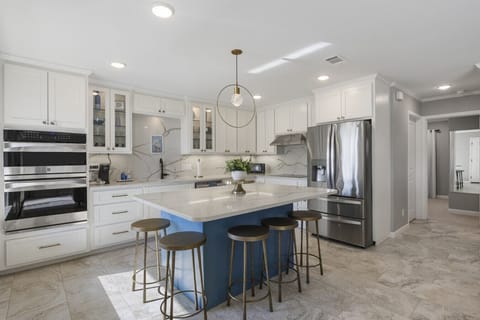 Enjoy casual meals or morning coffee at the kitchen island with comfy stools