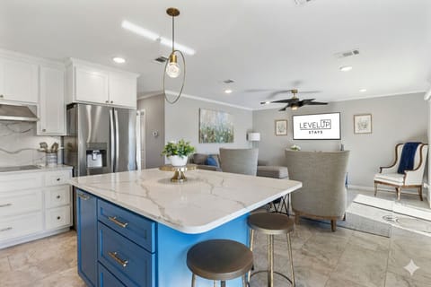 Open-concept kitchen flows into the living area, perfect for entertaining or relaxing together