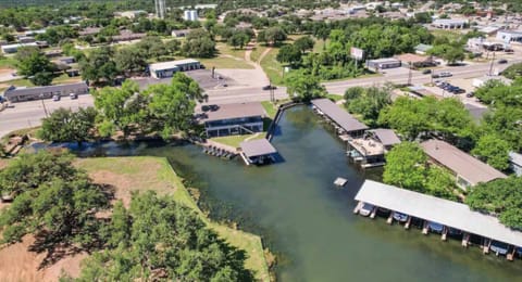 Bird’s-eye view of your lakeside escape—just steps from the water and surrounded by Hill Country beauty