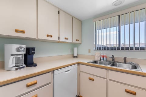 Start your beach mornings right with a fresh brew from the coffee bar in this fully equipped kitchen. Enjoy plenty of counter space, natural light, and all the essentials for your coastal getaway.