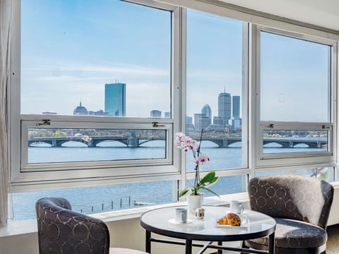 Sip morning coffee while the skyline stretches across the windows.