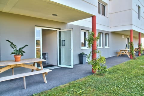 Step outside your door and relax under the covered walkway.