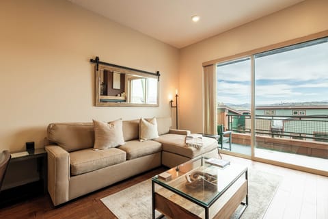 Living room with fireplace and balcony access