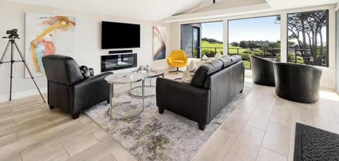 A stylish, airy living room with panoramic views right from the couch.