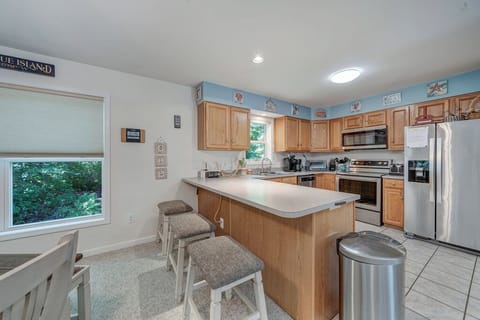 The Kitchen, with Breakfast Bar, is well-equipped with all the comforts of home.