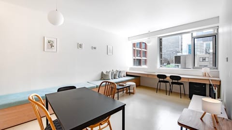 Bright and open living space with large windows and minimalist décor.