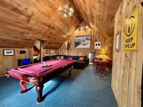 Our Epic Game Room featuring a pool table, card table, dart board, wireless speakers