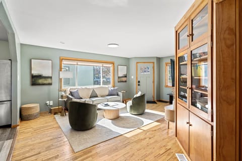Living Room: Sunlit retreat with plush seating, inviting decor, and a perfect spot for relaxation.