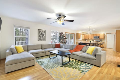 The living room is an open concept connected to the kitchen and dining room