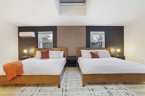 The roomy primary bedroom has 2 king beds providing a comfortable sleeping space