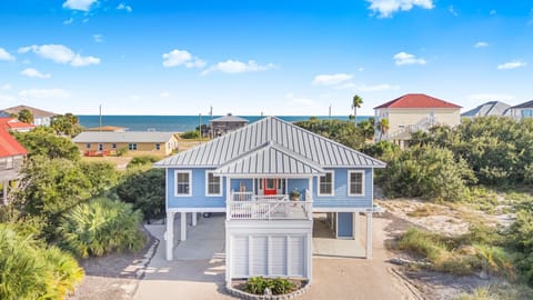 From the moment you pull up, this home welcomes you with plenty of parking and a relaxed, coastal-inspired exterior that sets the tone for your island stay.