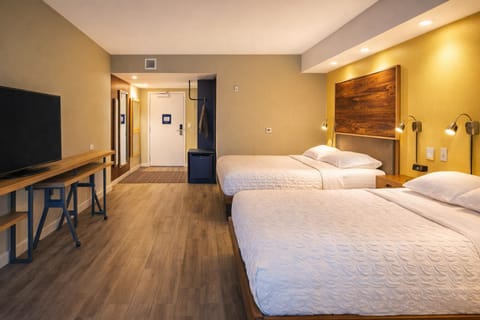 Unwind in a spacious double-queen room with modern comforts.