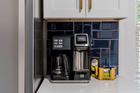 
Start your mornings right at this fully equipped coffee station with premium brewing options.