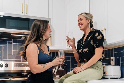 Gather your friends for wine and laughter in this stylish, modern kitchen space.