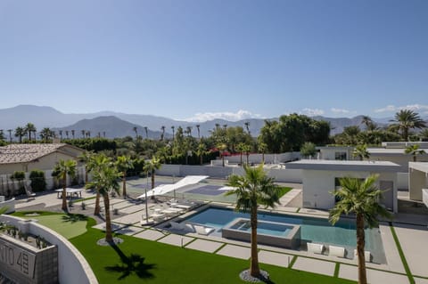 Incredible aerial views of the entire Elemento 49 resort compound, showcasing the pool, spa, Pickleball court, putting green, and the majestic mountain panorama.