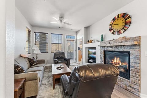 Unwind in your cozy living room where crackling fireplace flames create the perfect ambiance for relaxing evenings with loved ones.