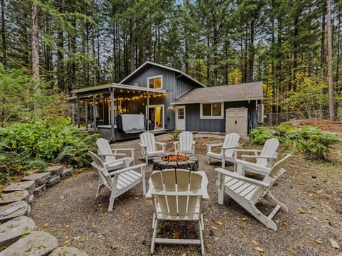 Welcome to Park Forest Hideaway: Private woodland retreat with outdoor firepit, string lights, and serene forest surroundings.