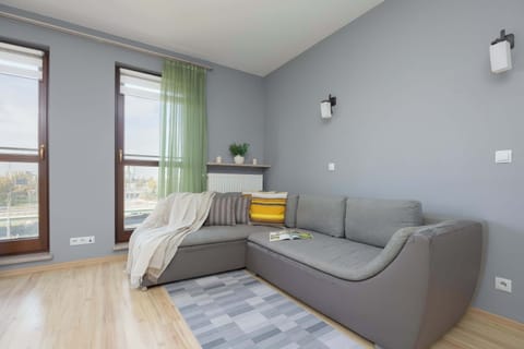 Relax in the stylish living room with a comfortable sofa and modern decor.