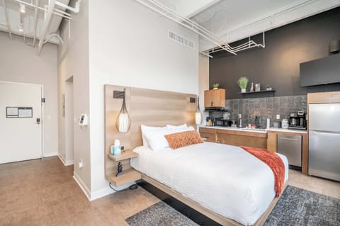 This home’s plush queen bed is ideal for recharging after a day on the town