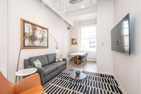 Unwind in the stylish living room & stream your favorites on the smart TV​