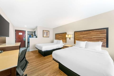 Gather comfortably with two beds and plenty of open floor space.