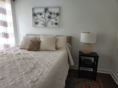 Queen-size Bed in light, sunny room